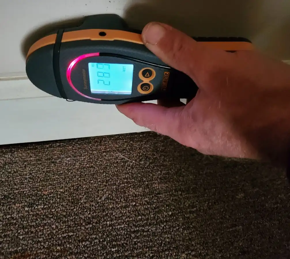 Moisture detection at baseboard during Burst Pipe Cleanup in Meadow Lakes
